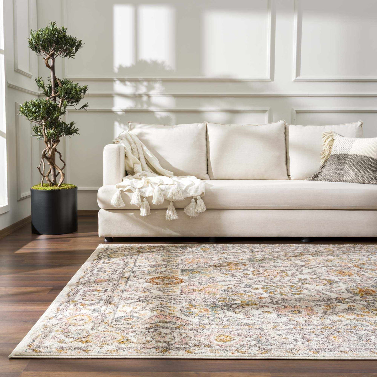 Herstmonceux area rug by Boutique Rugs displayed in a cozy living room setting with intricate patterns and neutral colors.