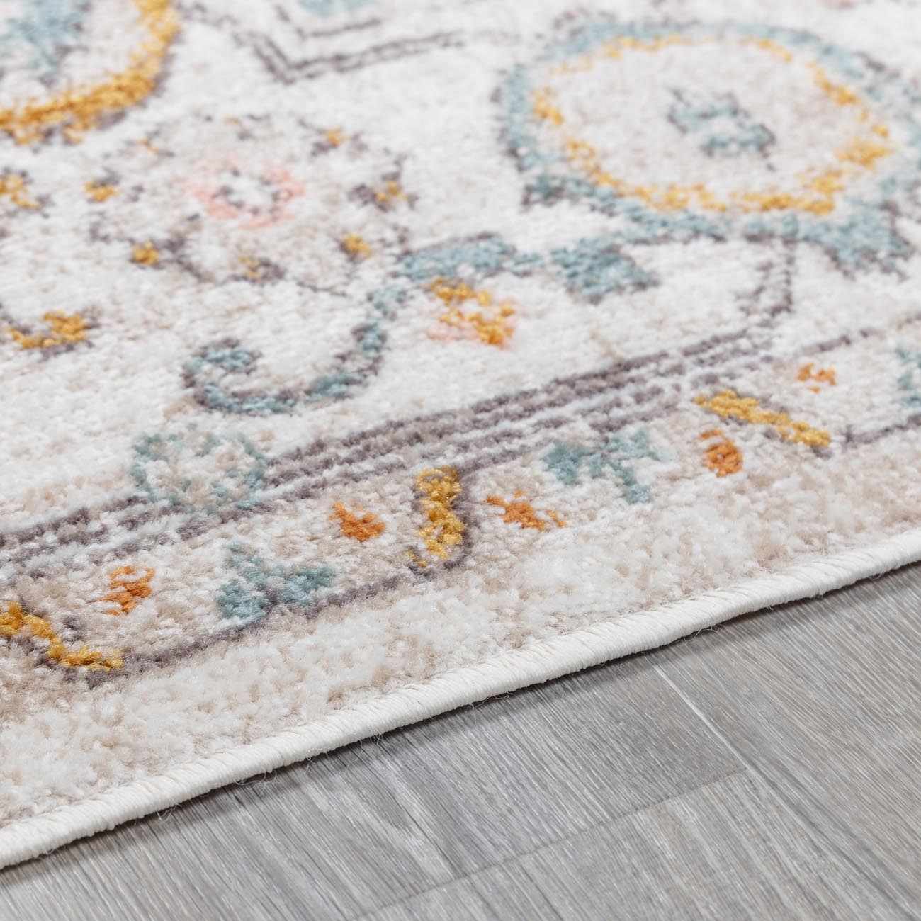 Herstmonceux area rug by Boutique Rugs, featuring a detailed pile design with warm colors and intricate patterns.