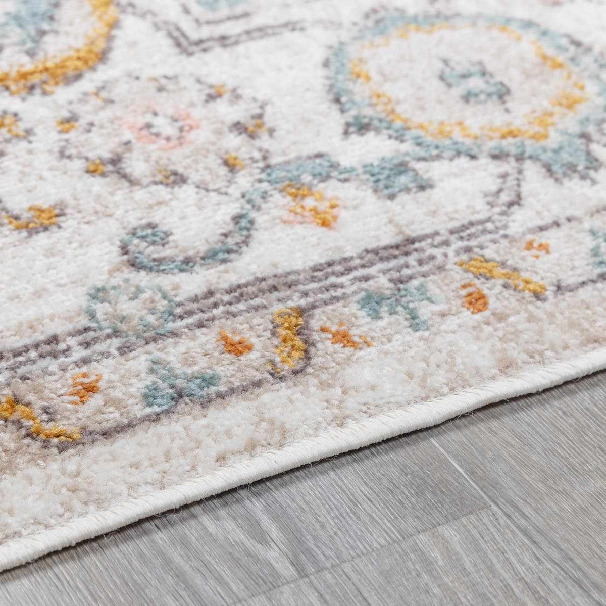 Herstmonceux area rug by Boutique Rugs, featuring a detailed pile design with warm colors and intricate patterns.