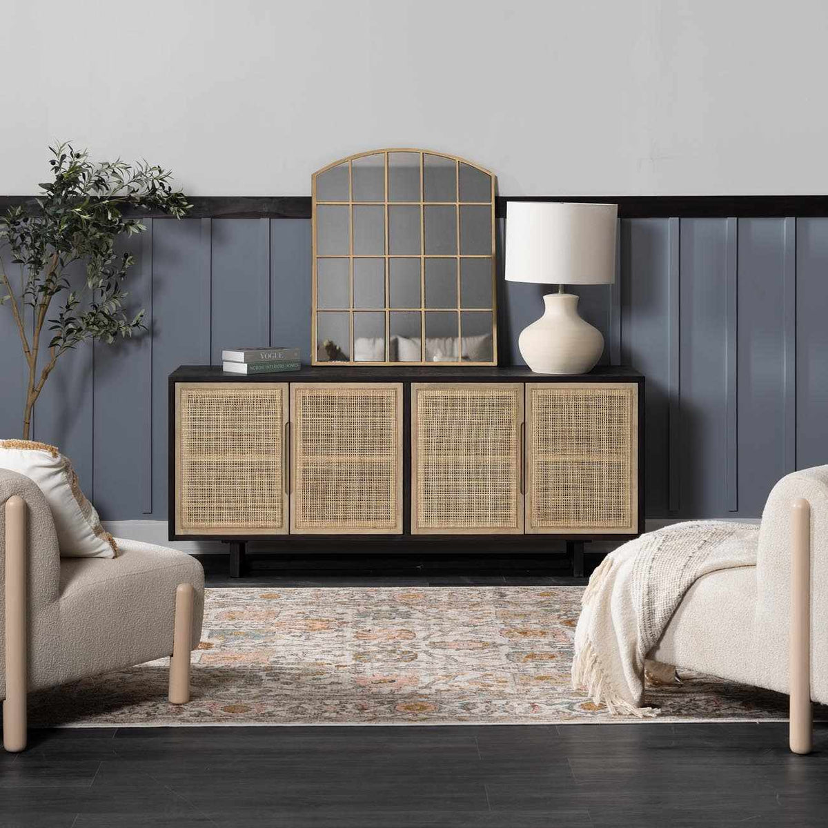 Herstmonceux area rug by Boutique Rugs in a cozy living room scene with furniture and decorative pillows on a plush, patterned rug.
