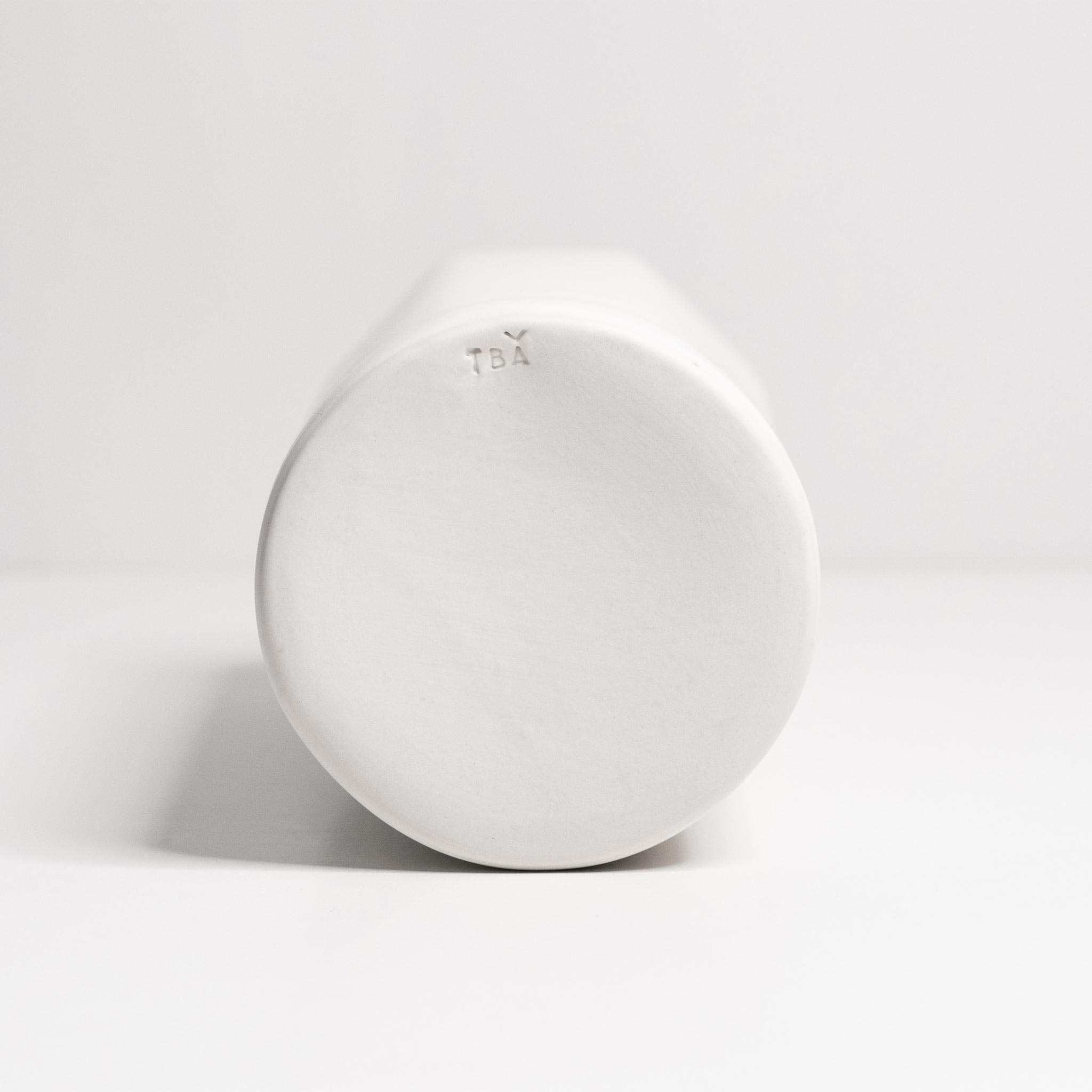 Handmade porcelain Bloom vase by Ember Collective, featuring a sleek, modern design with a smooth finish and elegant shape.
