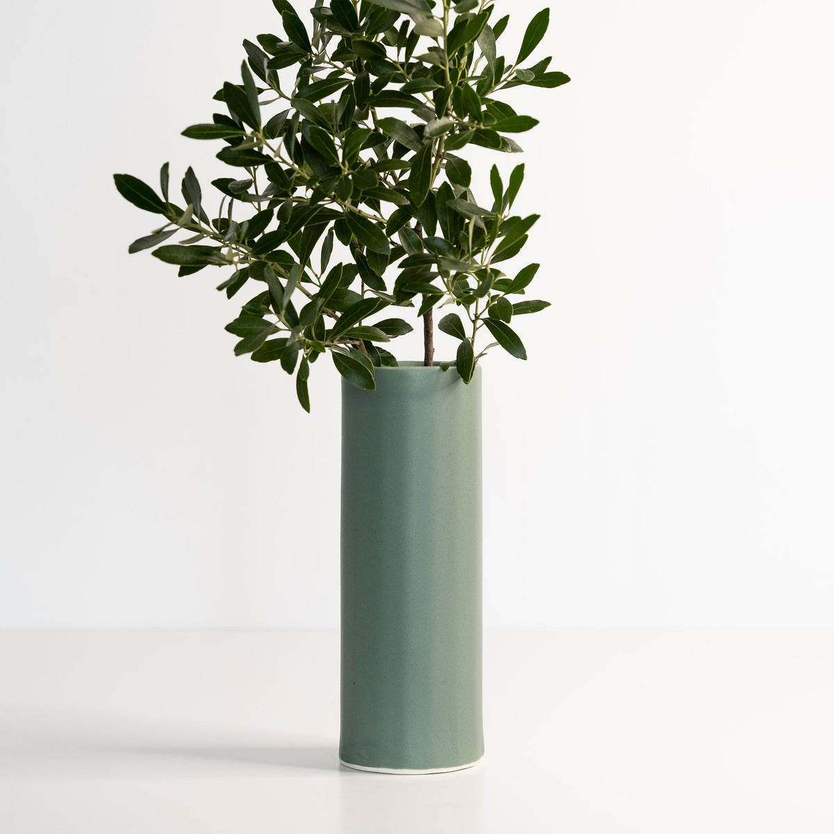 Handmade porcelain Bloom Vase by Ember Collective with a smooth, rounded design perfect for floral arrangements.