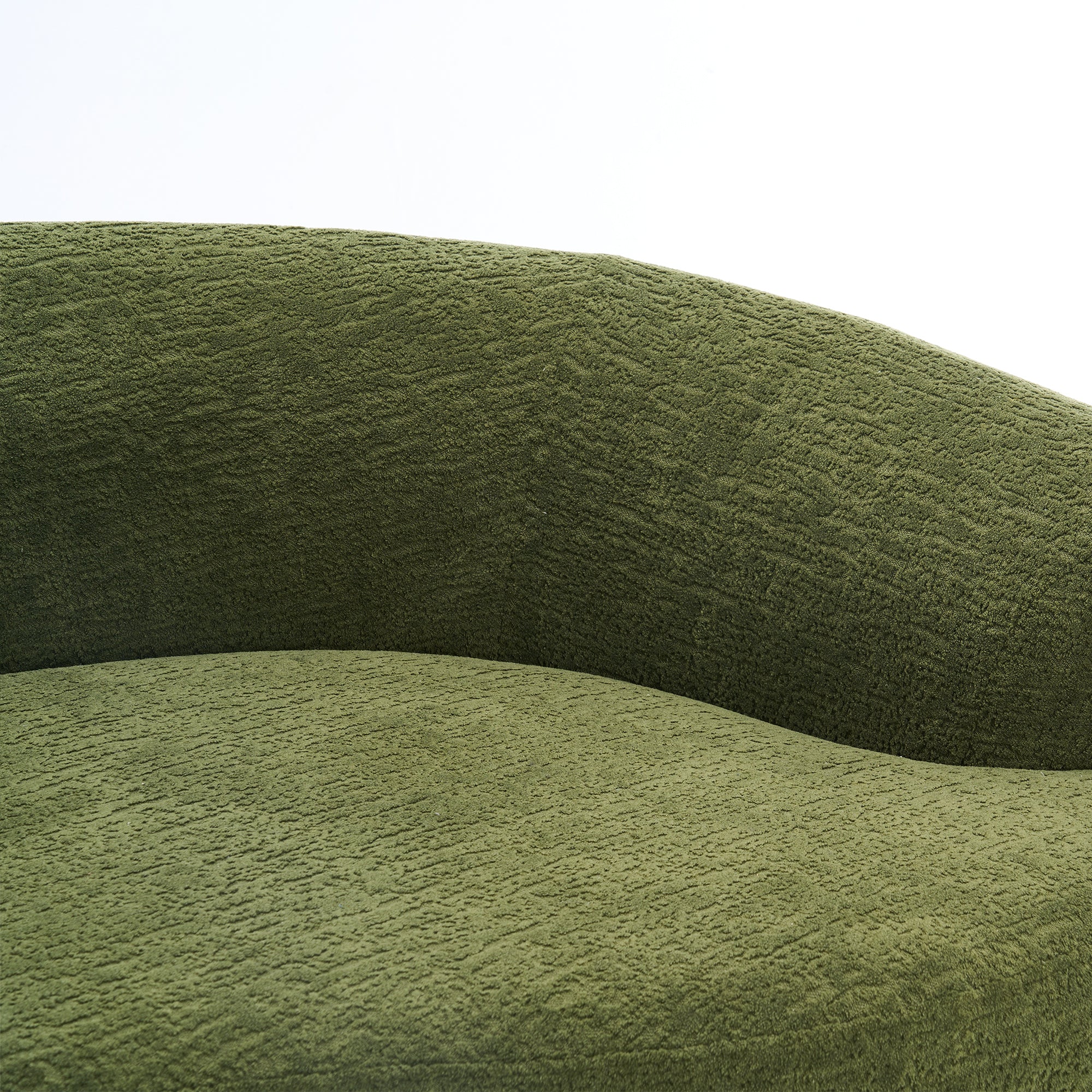 Forest green Anthony & Home Atelier curved sectional sofa with modular design, featuring plush cushions and sleek modern style.