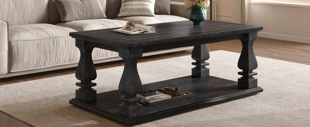 Weathered black farmhouse coffee table with heavy plank top, baluster legs, and storage shelf from Anthony & Home Atelier Collection.