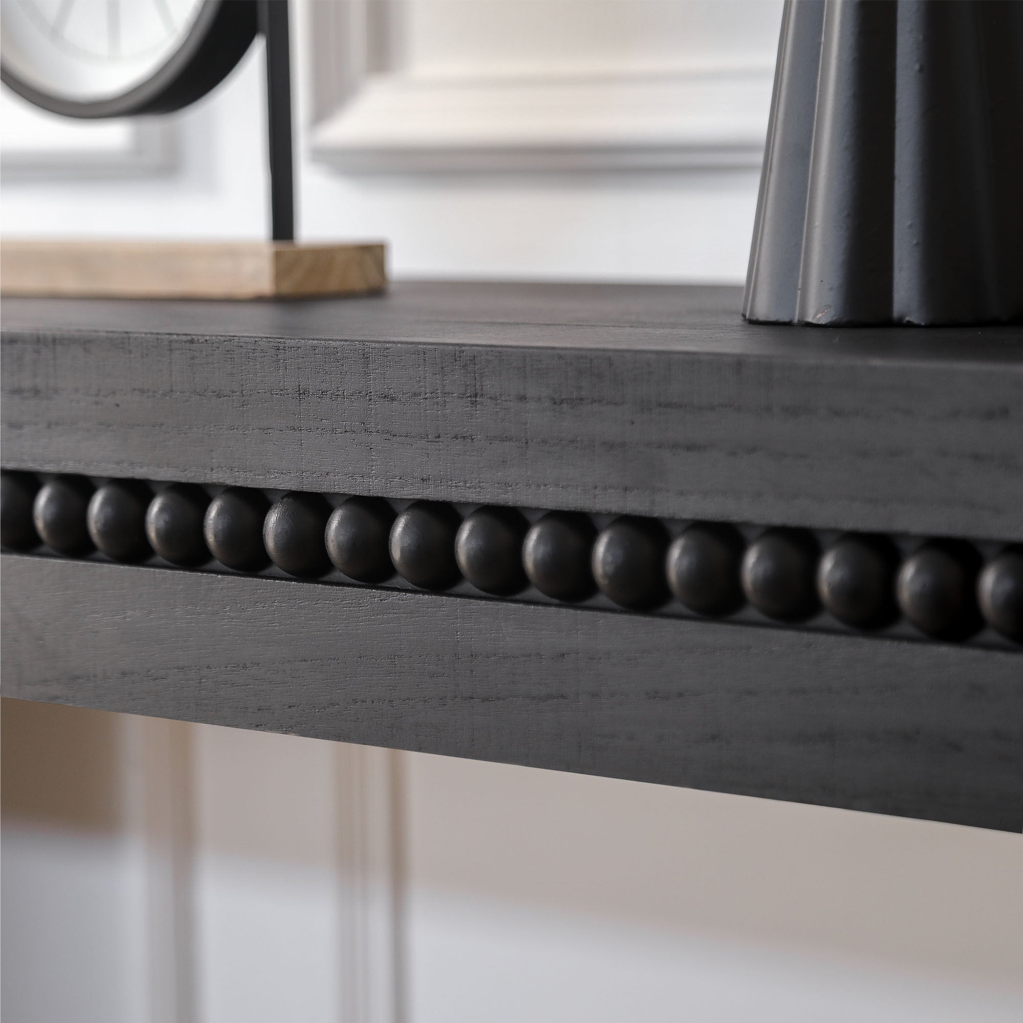 Antique black console table from Anthony & Home Artisan Collection, featuring a sleek design and sturdy wooden construction.