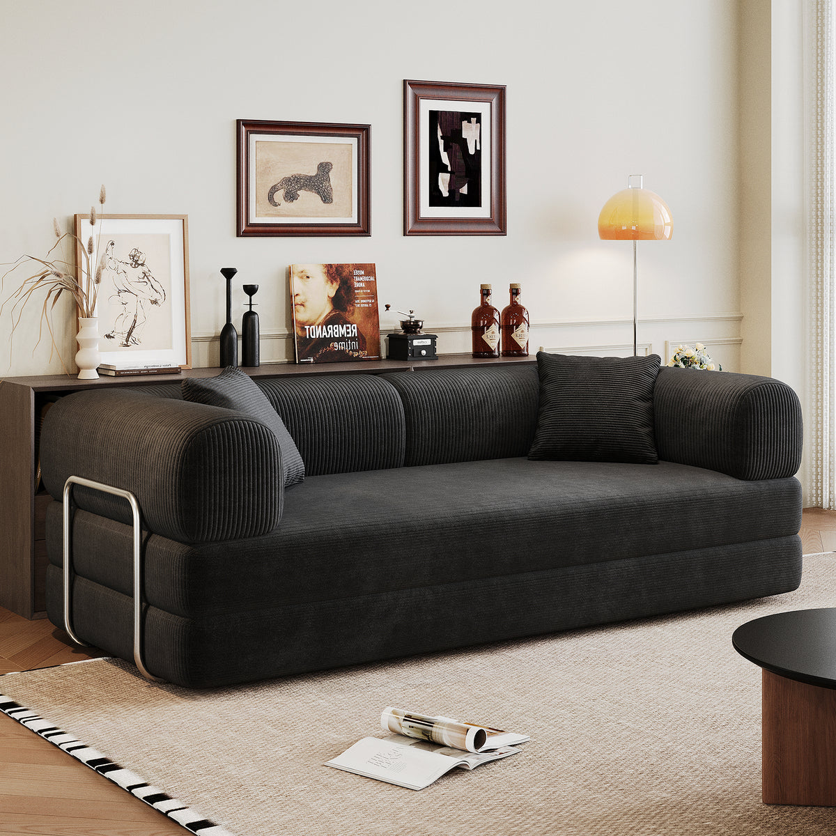 Black corduroy convertible sofa bed from Anthony & Home's Atelier Collection, showcasing its plush fabric and versatile design.