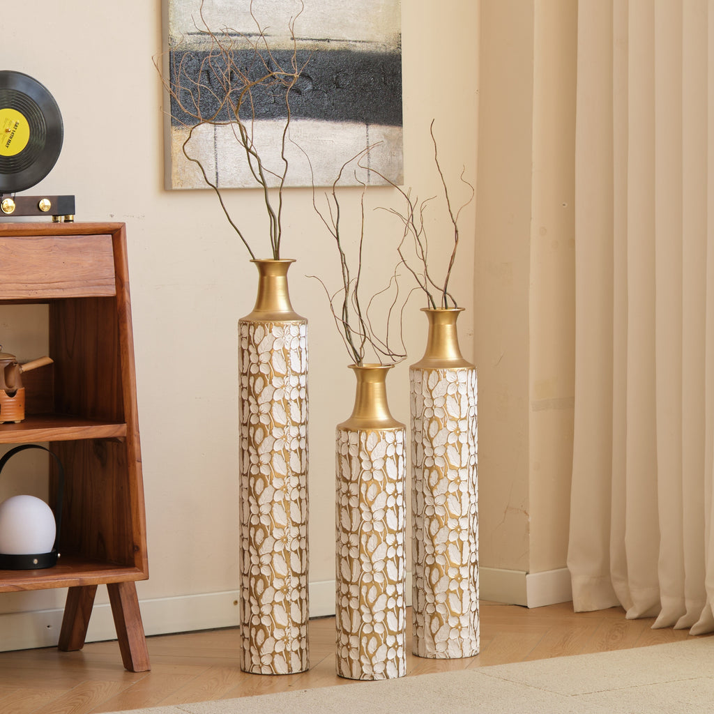 Heritage Collection floor vase trio by Anthony & Home, featuring three elegant ceramic vases with intricate patterns on a neutral background.