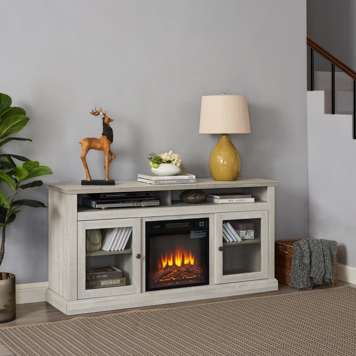 Stone gray finish Anthony & Home Studio TV media console with built-in fireplace, showcasing a modern design and sleek storage.