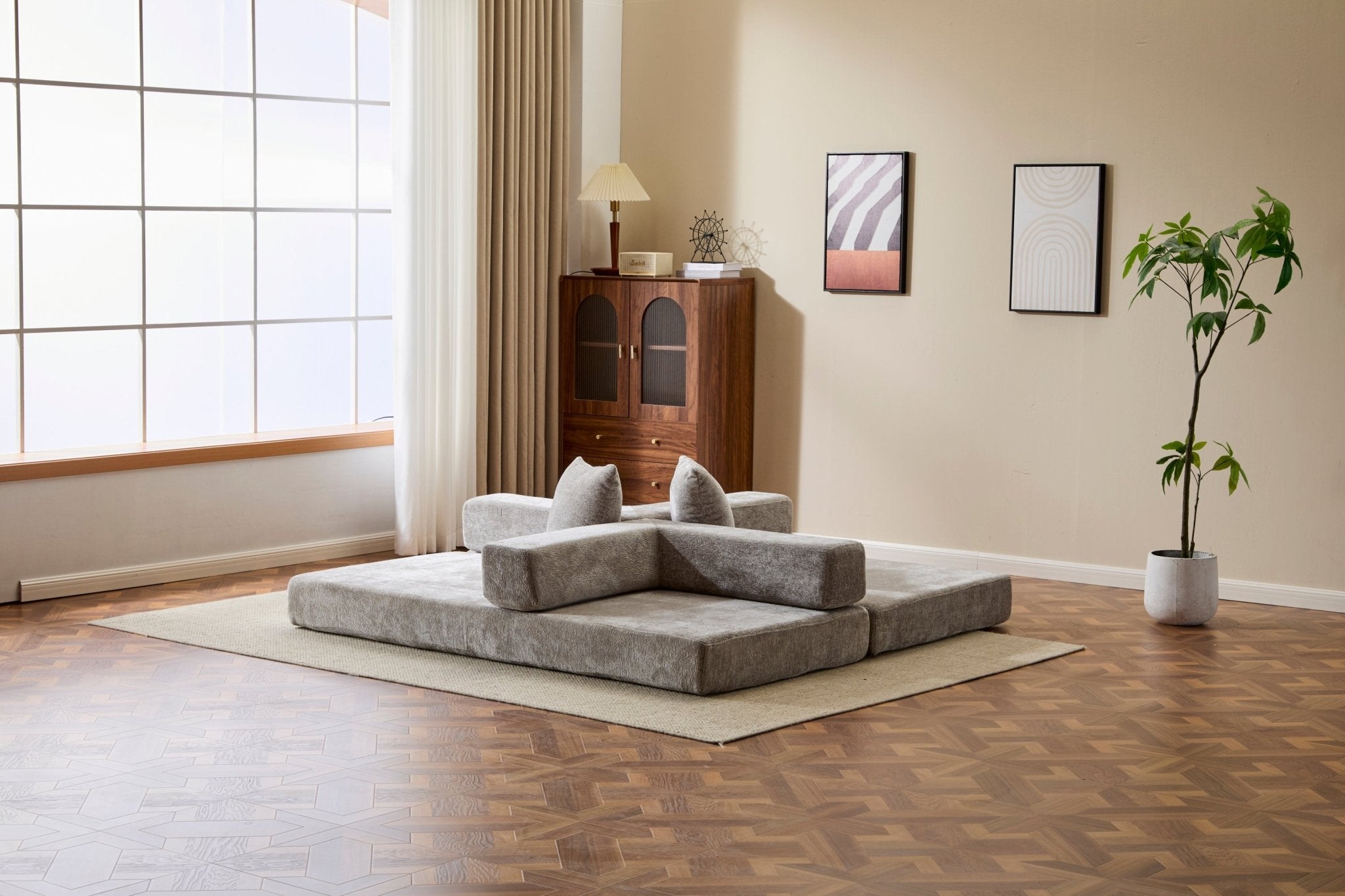 Light grey chenille convertible sofa bed with pillow back and signature edition design, ideal for lounging and sleeping.