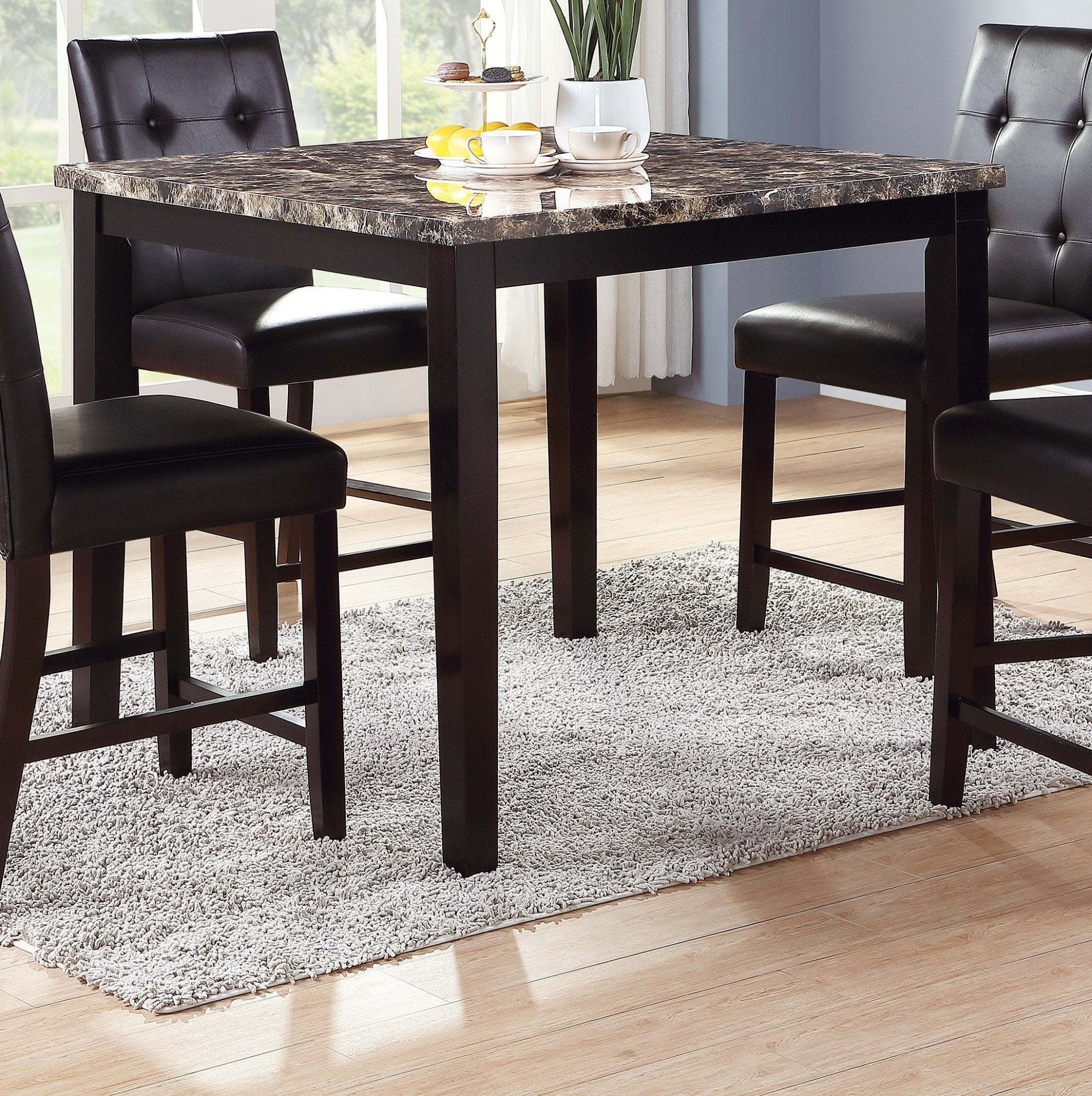 Counter height dining set by Anthony & Home featuring a faux marble table and matching chairs for modern kitchen seating.