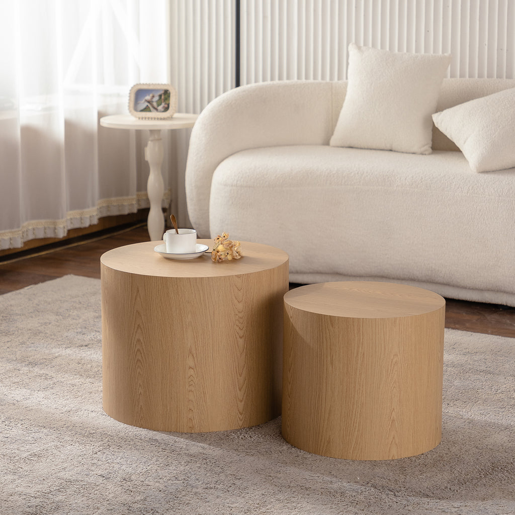 Set of nesting round coffee tables by Anthony & Home featuring sleek wooden tops and modern design.