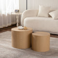 Set of nesting round coffee tables by Anthony & Home featuring sleek wooden tops and modern design.
