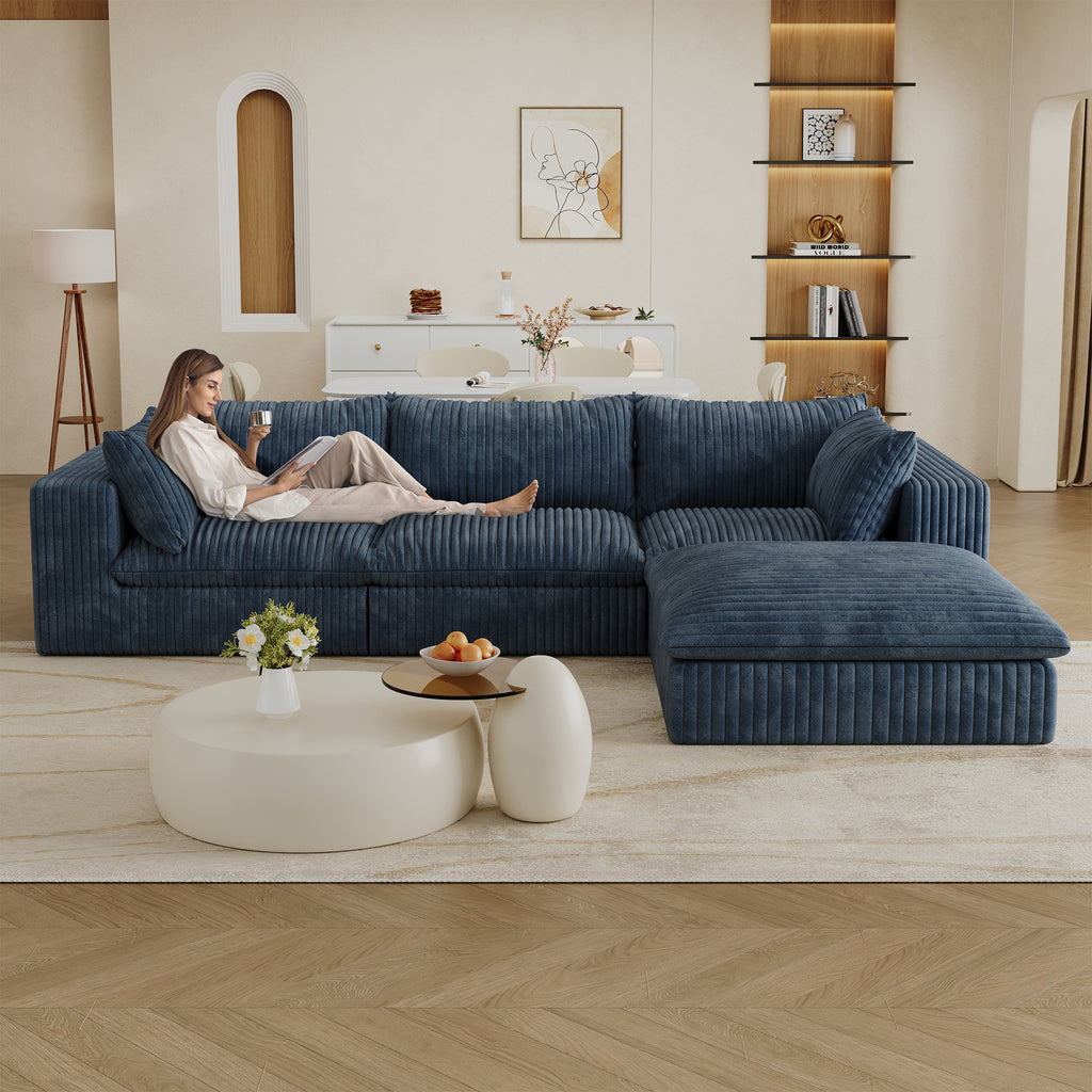 Blue corduroy cloud sofa from Anthony & Home with deep seat and removable cushions, part of the Atelier Collection.