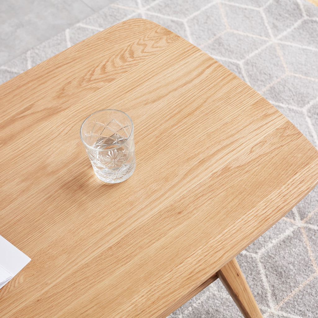 Natural oak coffee table with storage shelf from Anthony & Home's Atelier Collection, showcasing a timeless, elegant design.