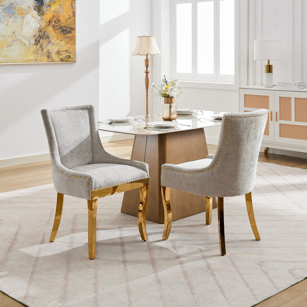 Beige chenille dining chairs with gold-plated legs from Anthony & Home, showcasing a stylish and comfortable seating design.