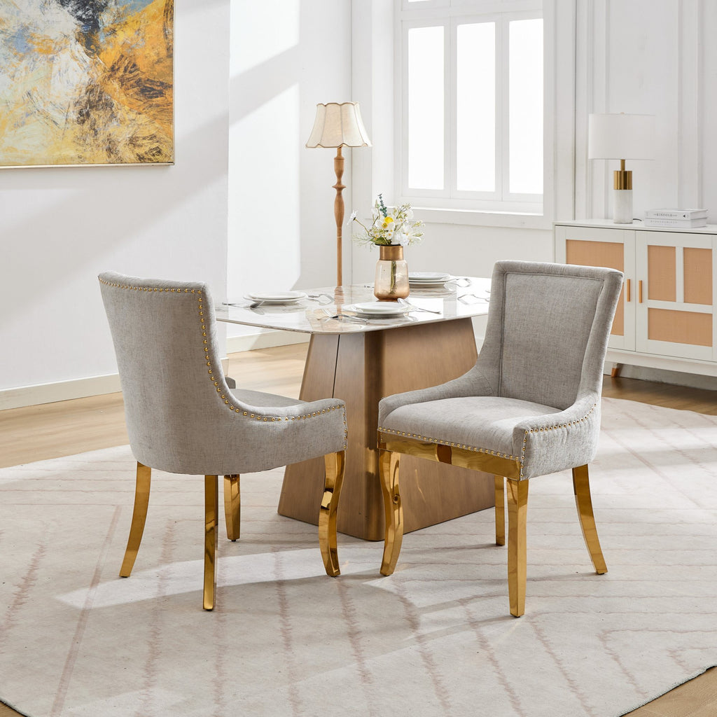Beige chenille dining chairs with gold plated legs, stylish and comfortable, designed by Anthony & Home for modern dining rooms.