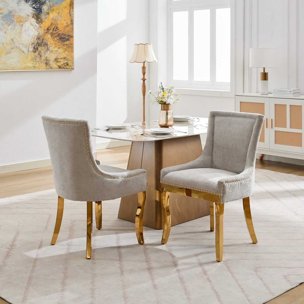 Beige chenille dining chairs with gold plated legs, stylish and comfortable, designed by Anthony & Home for modern dining rooms.