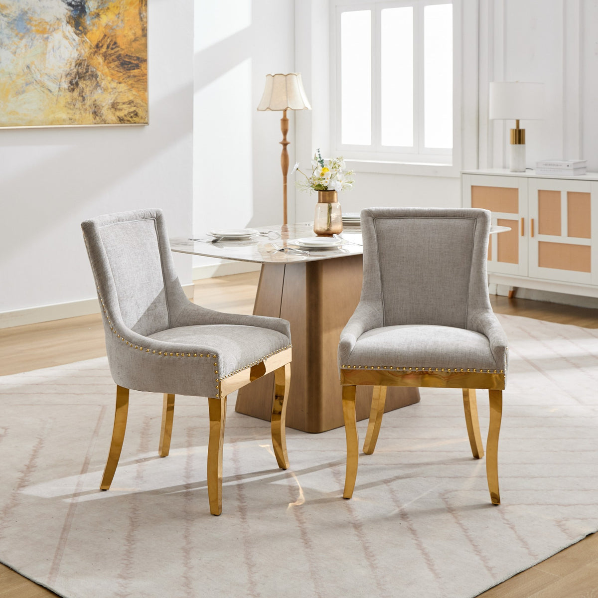 Beige Anthony & Home chenille dining chair with gold-plated legs, modern design, and plush upholstery in a studio setting