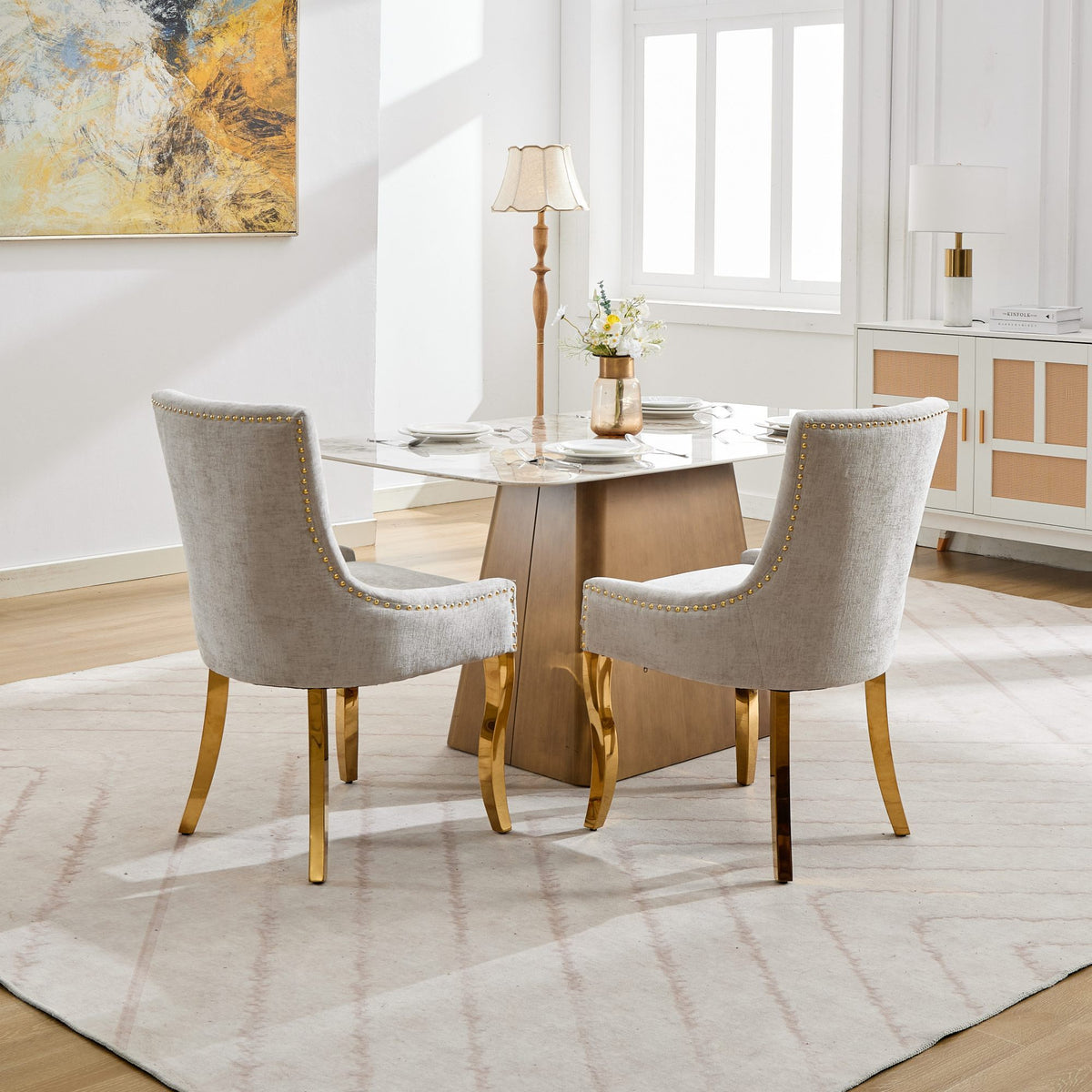 Beige chenille dining chair with gold plated legs from Anthony & Home, modern studio style, showing plush upholstery and elegant design.
