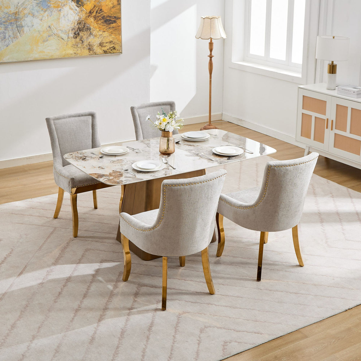 Beige chenille dining chair with gold-plated legs from Anthony & Home, showcasing plush fabric and elegant gold accents.