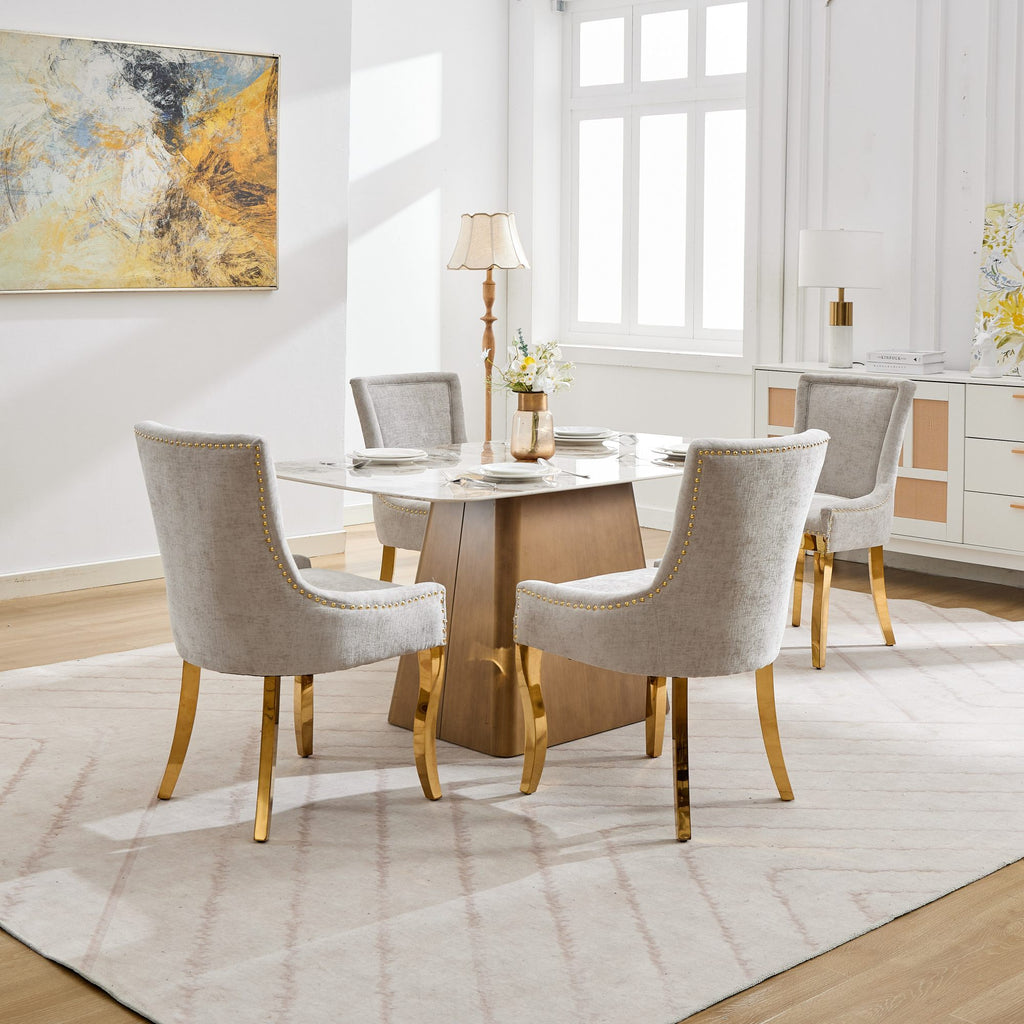 Beige chenille dining chairs with gold-plated legs from Anthony & Home, featuring a stylish and comfortable studio design.