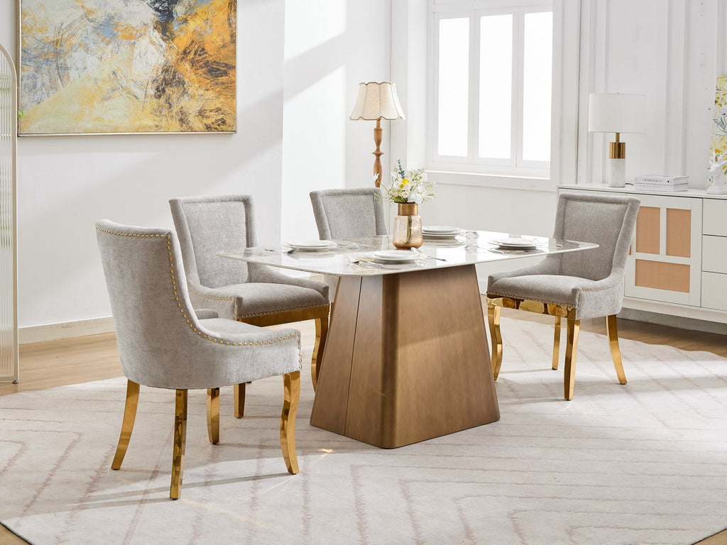Beige chenille dining chairs with gold plated legs from Anthony & Home, showcasing plush upholstery and elegant modern design.