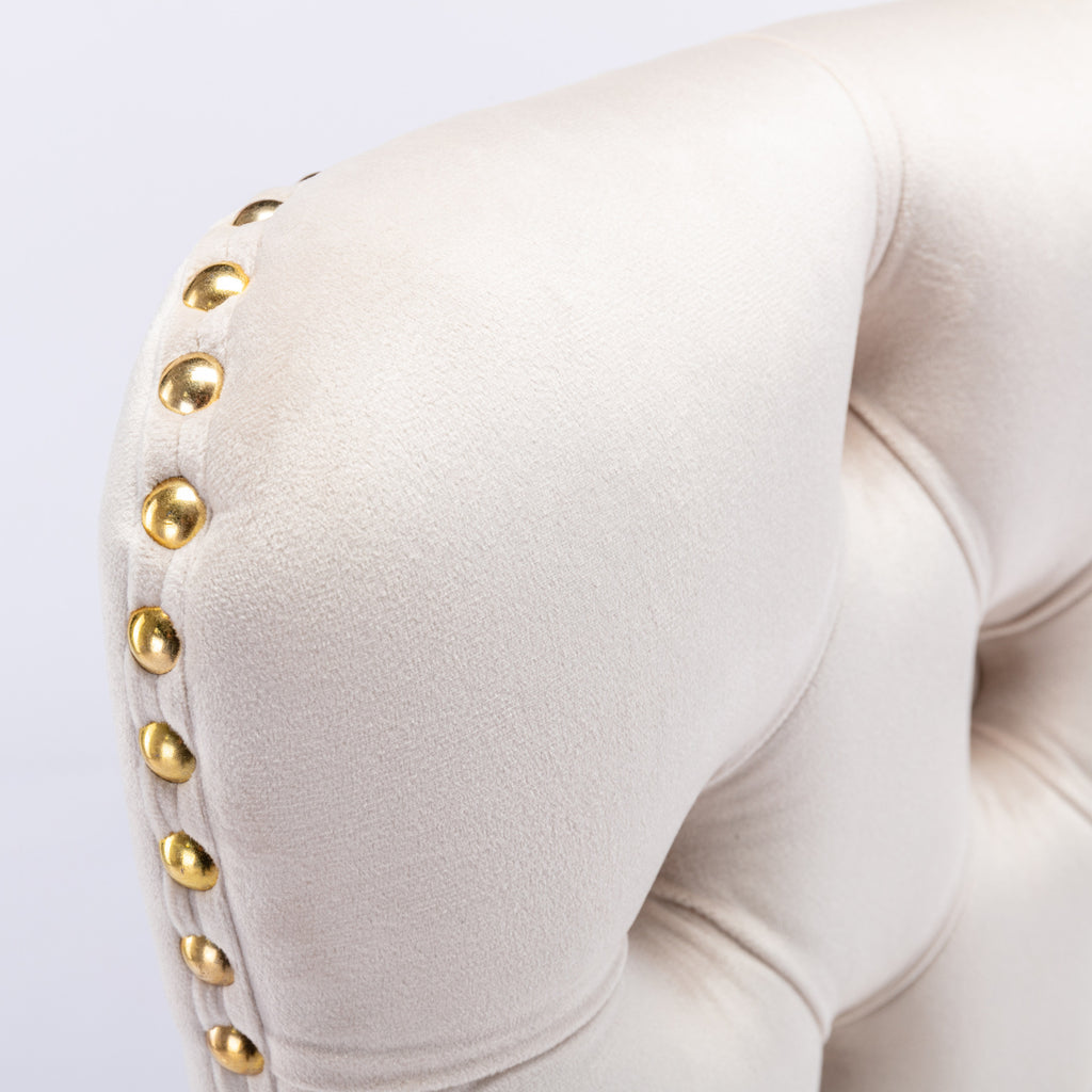 Beige velvet bar stools with tufted seats and copper nailhead trim from AA Furniture by Anthony & Home.