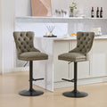 Pair of aged retro PU leather bar stools by Anthony & Home, featuring vintage-style design and sturdy metal legs.