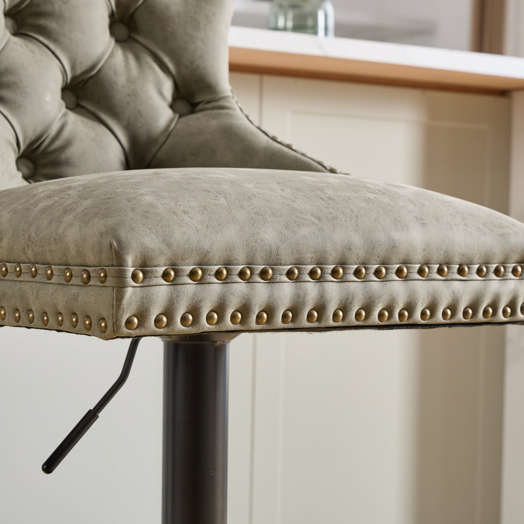 Pair of aged retro PU leather bar stools from Anthony & Home, featuring vintage-style design and sturdy metal legs.