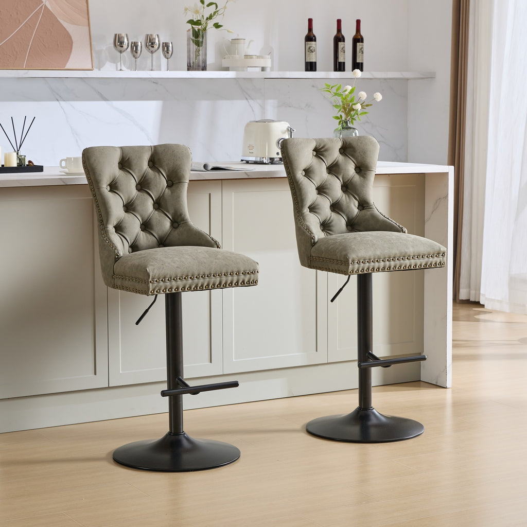 Pair of aged retro-style PU leather bar stools from Anthony & Home, featuring vintage design and sturdy metal bases.
