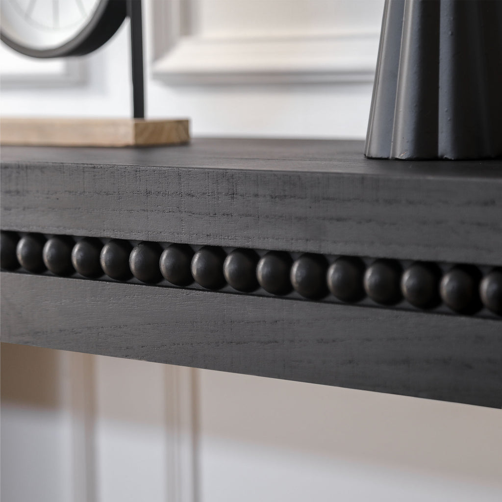 Antique black console table from Anthony & Home Artisan Collection, featuring a sleek design and sturdy wooden construction.