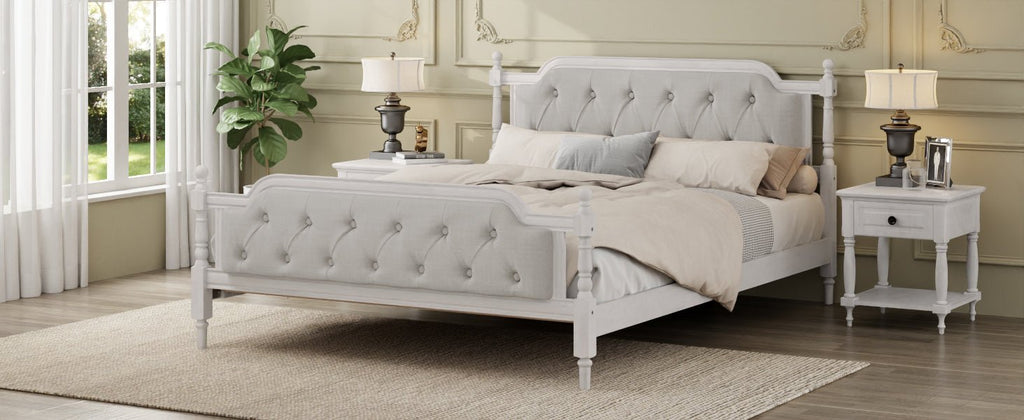 Antique white king bed frame with linen tufted headboard and wooden legs, styled in a classic bedroom setting.