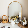Arched gold metal mirror from Anthony & Home Classic Collection, with a sleek, elegant frame and reflective glass surface.