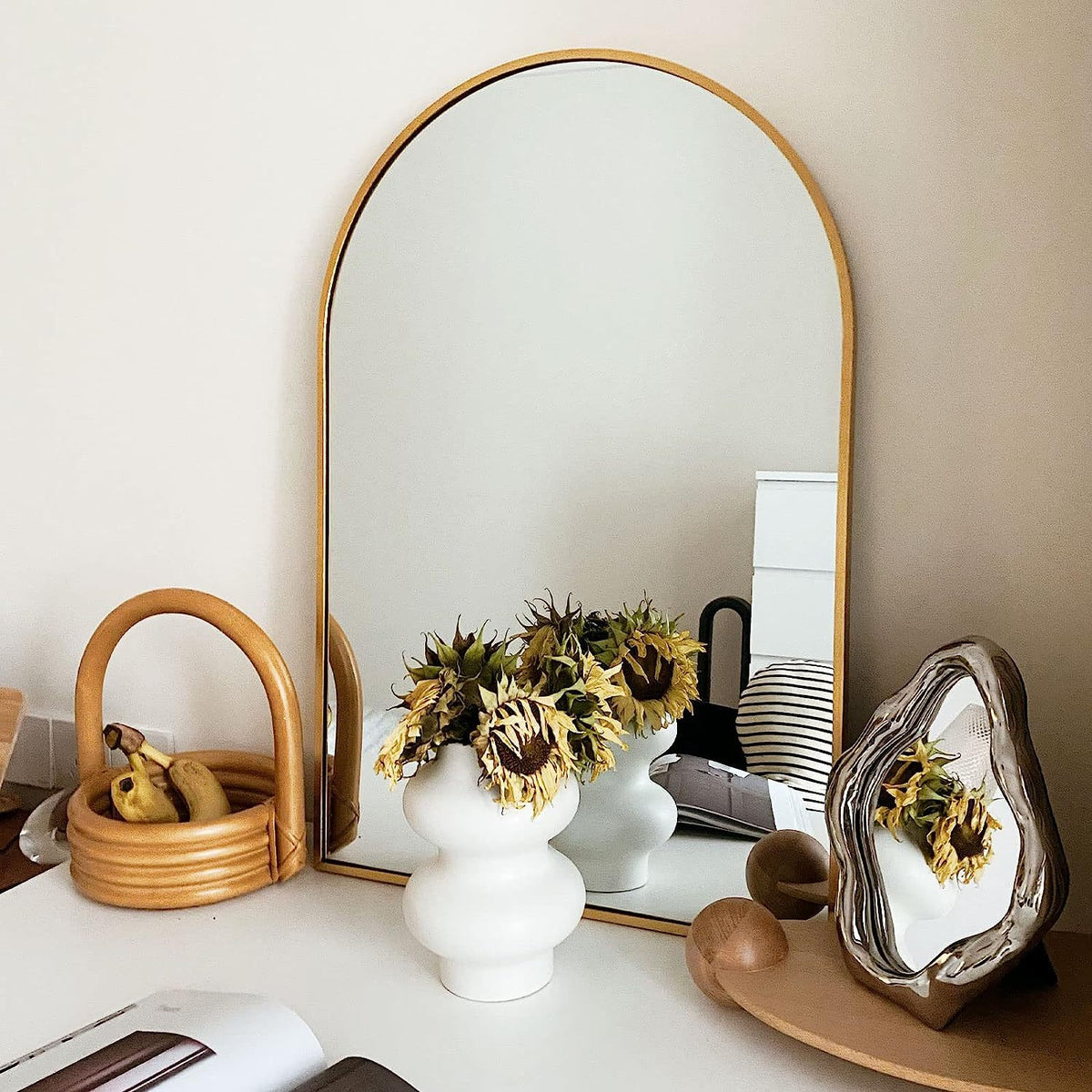 Arched gold metal mirror from Anthony & Home Classic Collection, with a sleek, elegant frame and reflective glass surface.