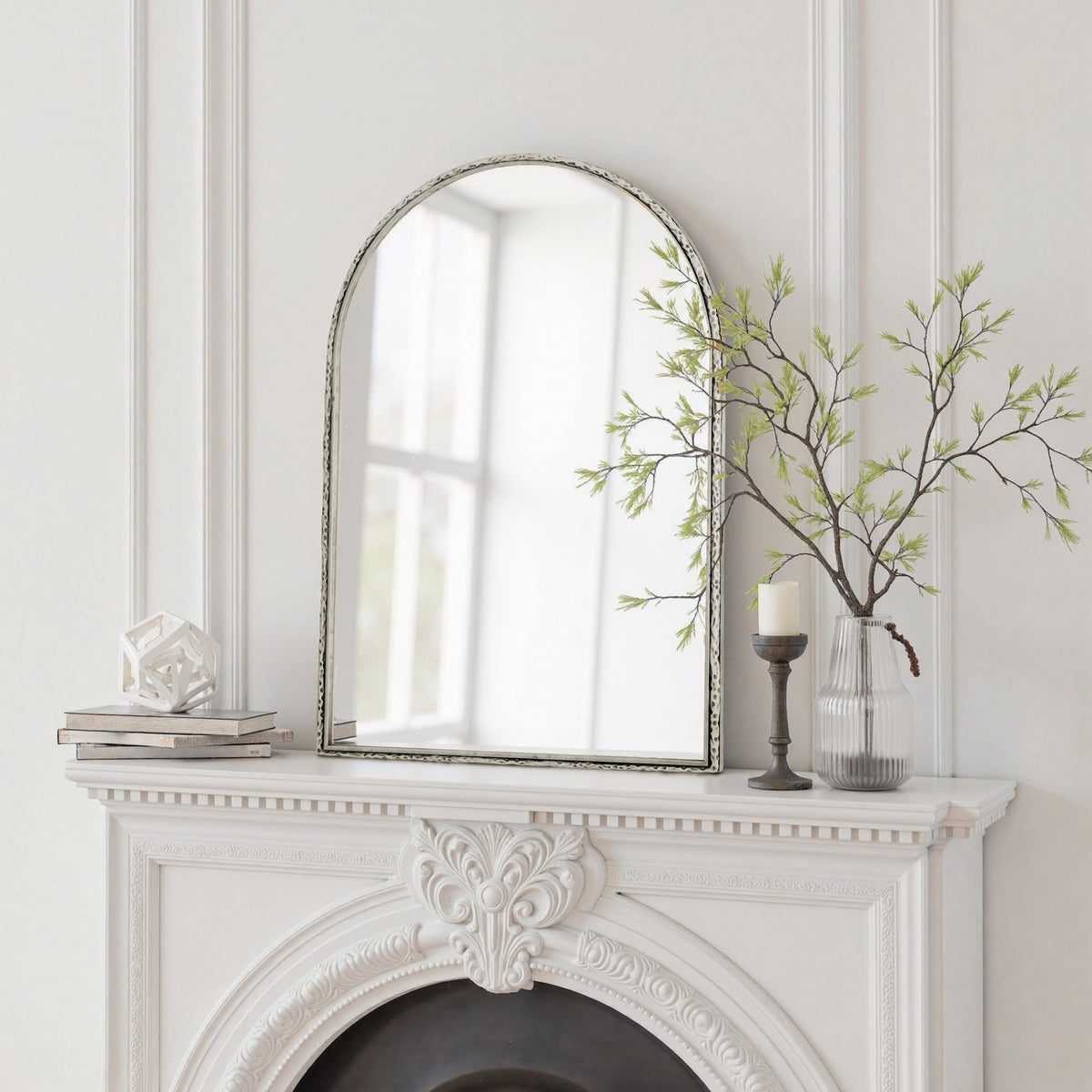 Arched silver mirror with tempered glass frame by Anthony & Home, showcasing a sleek, modern design with reflective surface.