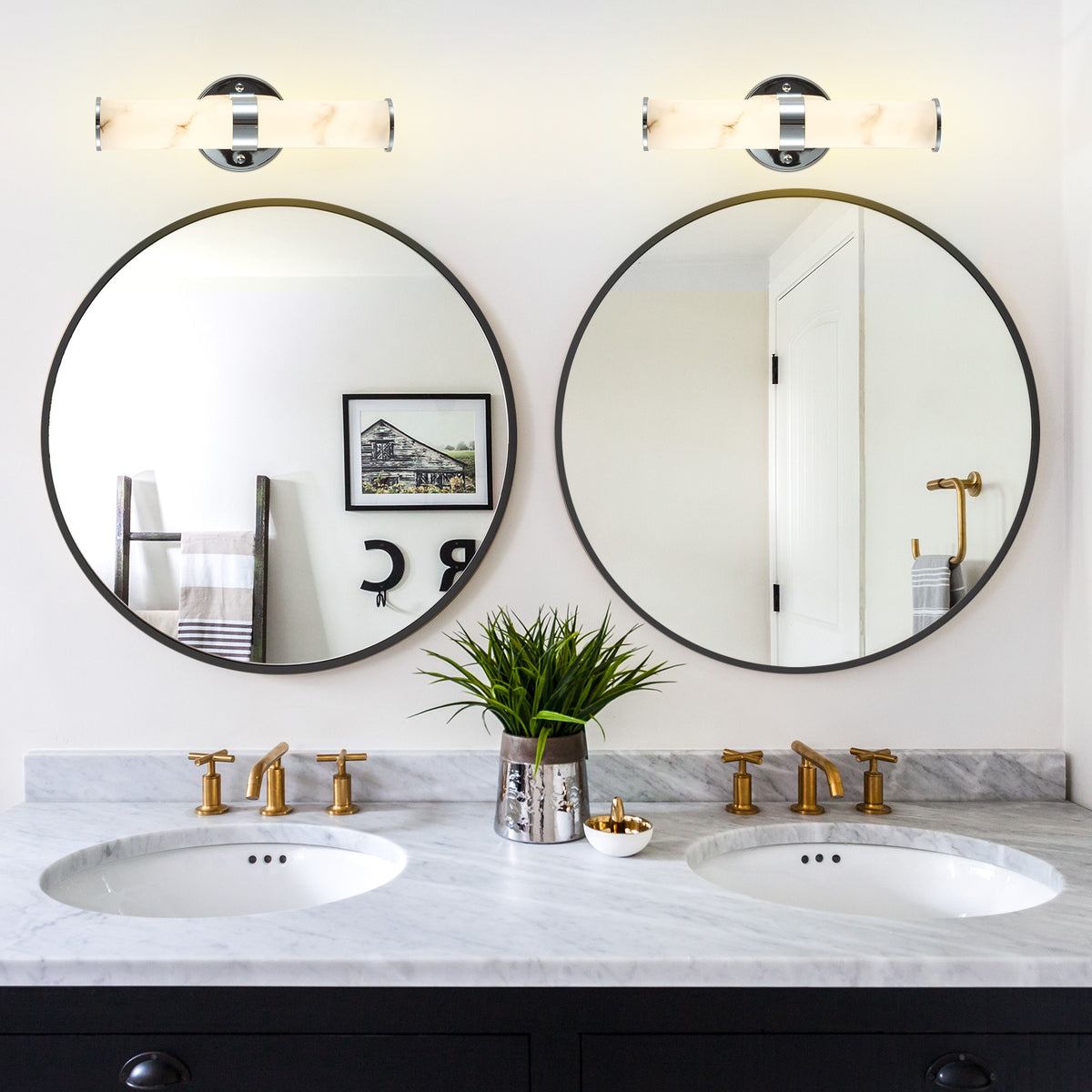 Pair of Anthony & Home Atelier marble wall sconces with sleek, modern design mounted on a wall for stylish lighting.