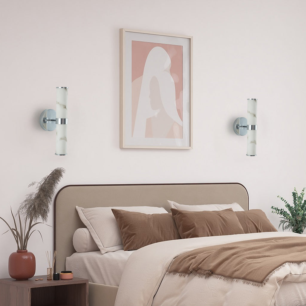 Set of two Anthony & Home Atelier marble wall sconces with sleek, modern design and white marble finish for stylish lighting.
