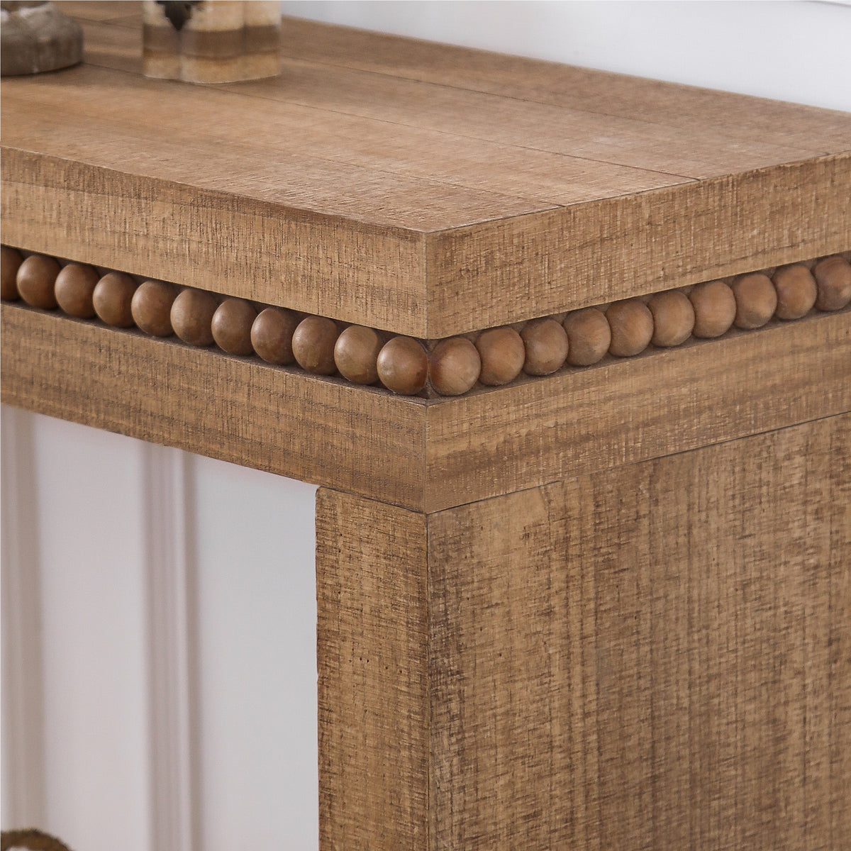 Beaded accent console table by Anthony & Home with elegant rustic design, perfect for living room decor.