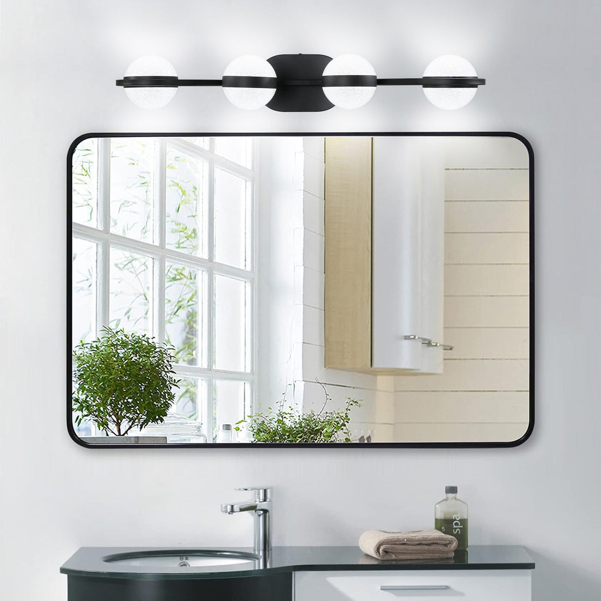 Black 4-light vanity fixture by Anthony & Home with crystal sand acrylic shades and modern design.