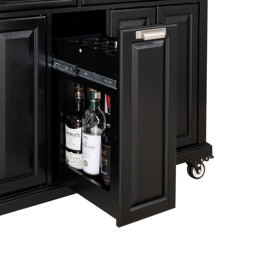 Black rubberwood kitchen island from Anthony & Home featuring a spacious surface and storage drawers in a contemporary design.