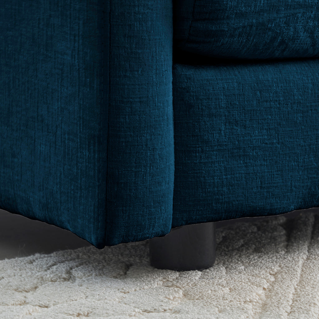Blue chenille L-shaped sofa with reversible ottoman from Anthony & Home, showcasing plush upholstery and modern modular design.