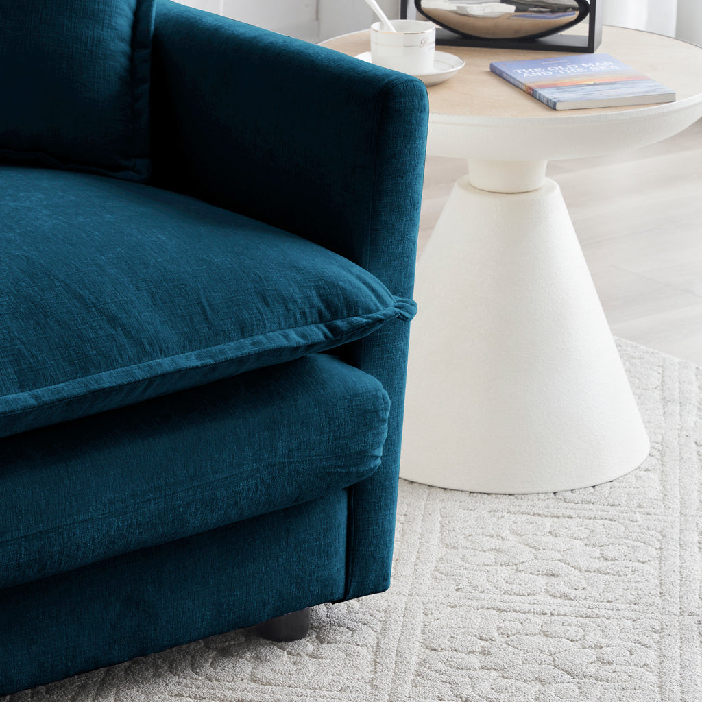 Blue chenille modular L-shaped sofa with reversible ottoman by Anthony & Home, shown with plush cushions and contemporary design.