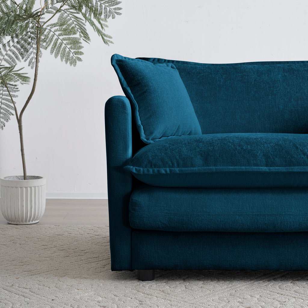 Blue chenille modular L-shaped sofa with reversible ottoman by Anthony & Home, shown with plush cushions and modern design.