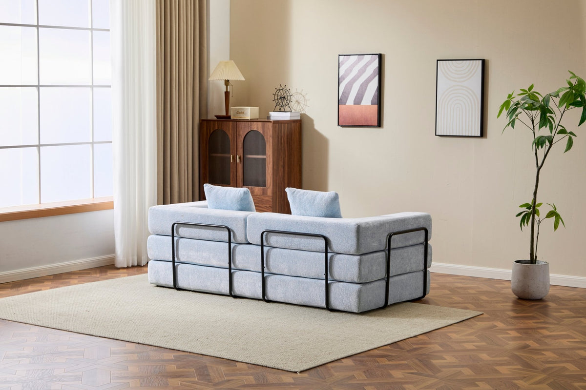 Light blue Anthony & Home Chenille Collection convertible floor sofa bed with memory foam cushions, shown in a relaxed, unfolded position.