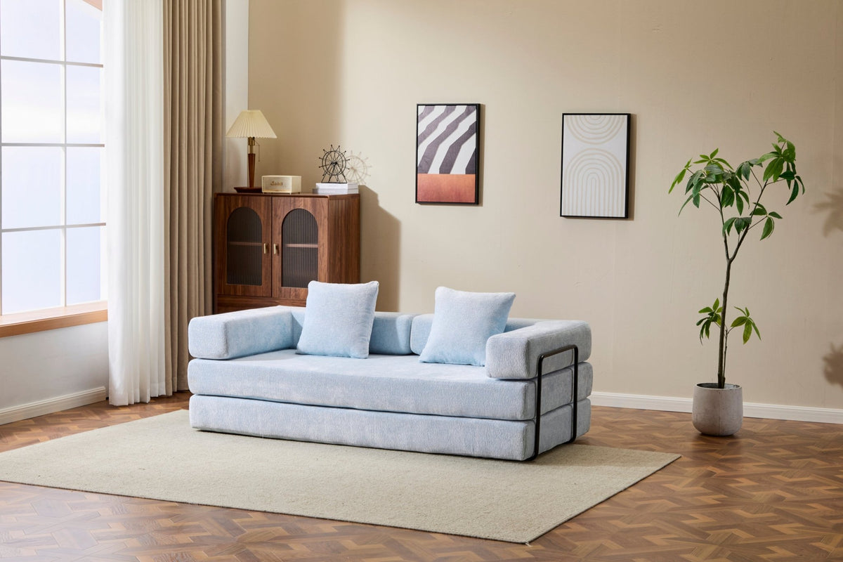 Light blue convertible floor sofa bed from Anthony & Home's Chenille Collection with memory foam cushions on a modern living room floor