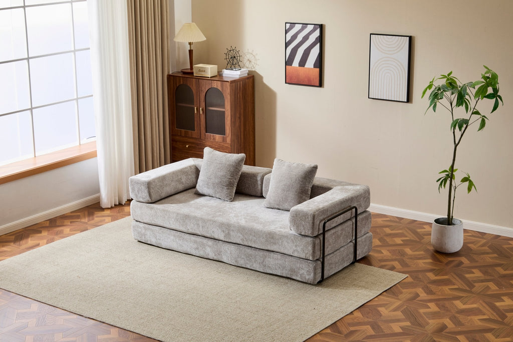 Light grey Anthony & Home chenille sofa bed with pillow back, convertible into a comfortable floor bed in signature edition style.