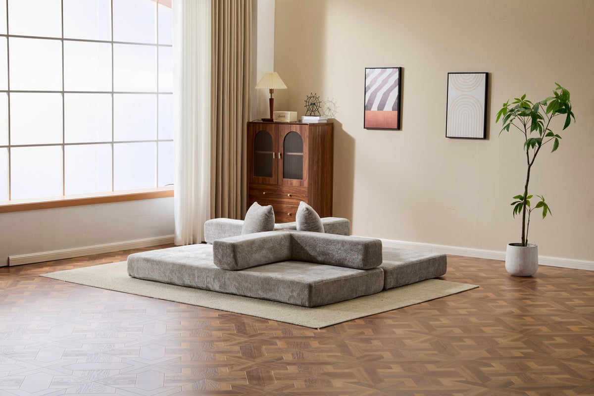 Light grey chenille convertible sofa bed with pillow back and signature edition design, ideal for lounging and sleeping.