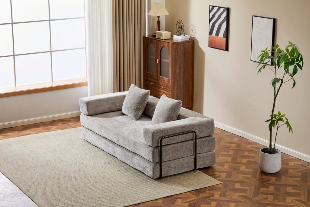 Light grey Anthony & Home chenille floor sofa bed with convertible design and pillow back, signature edition, shown in a cozy living space.