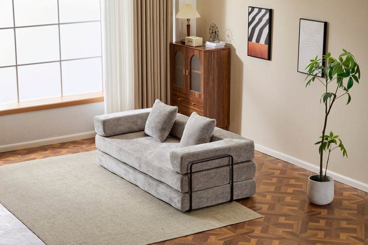 Light grey Anthony & Home chenille floor sofa bed with convertible design and pillow back, signature edition, shown in a cozy living space.