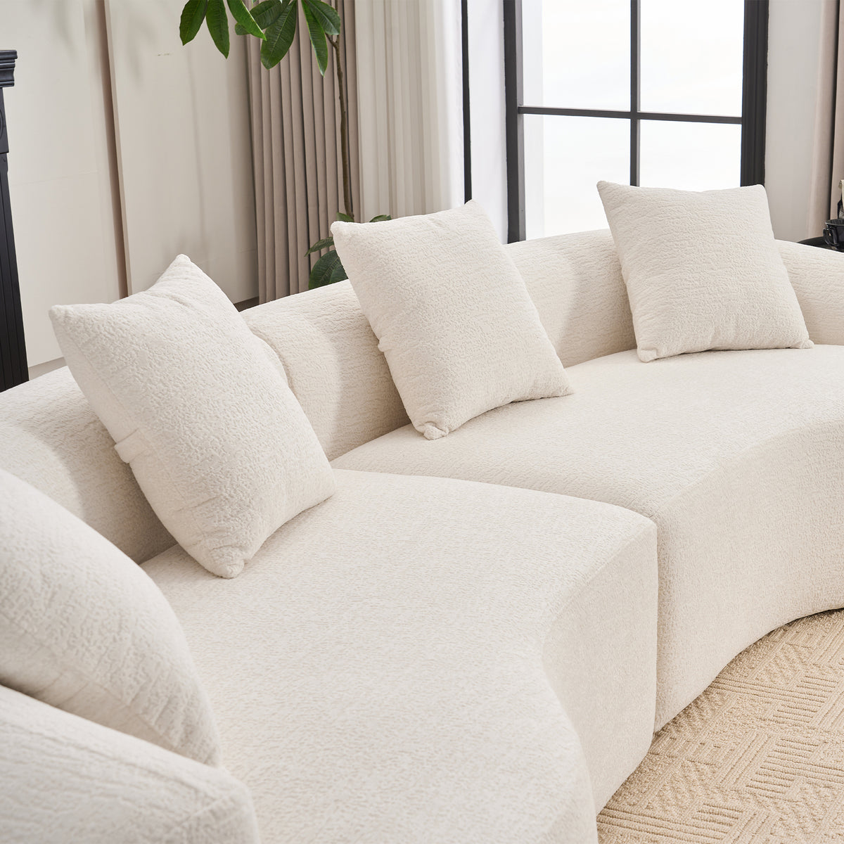 Chenille Luxe Signature curved modular sofa in cloud white upholstery from Anthony & Home Studio Collection.